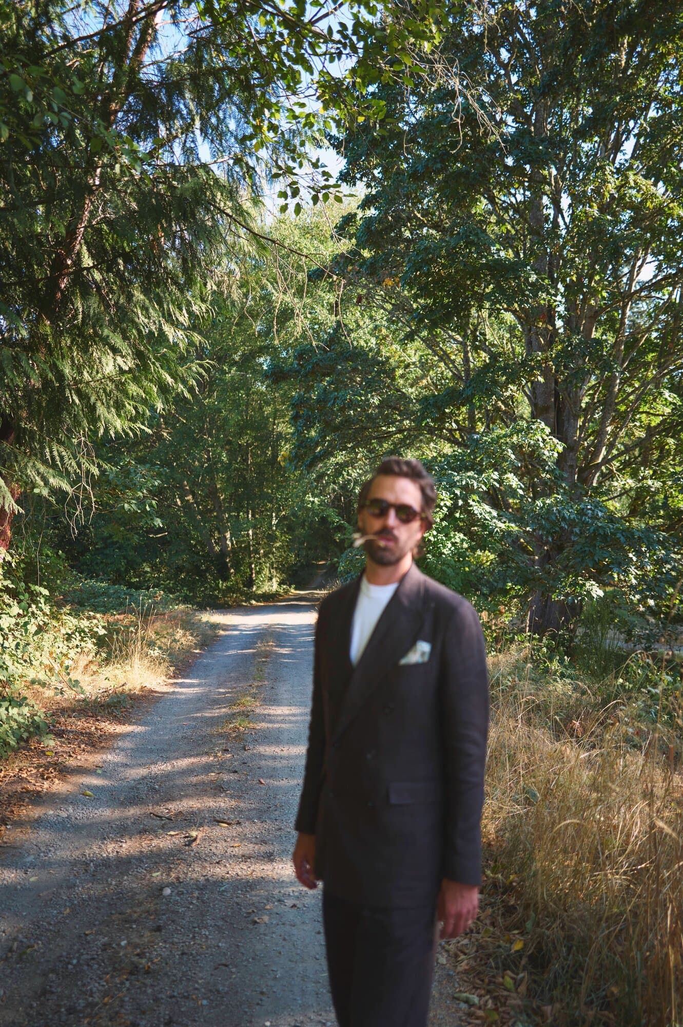 Jason Bowman, writer, portrait on a forest path