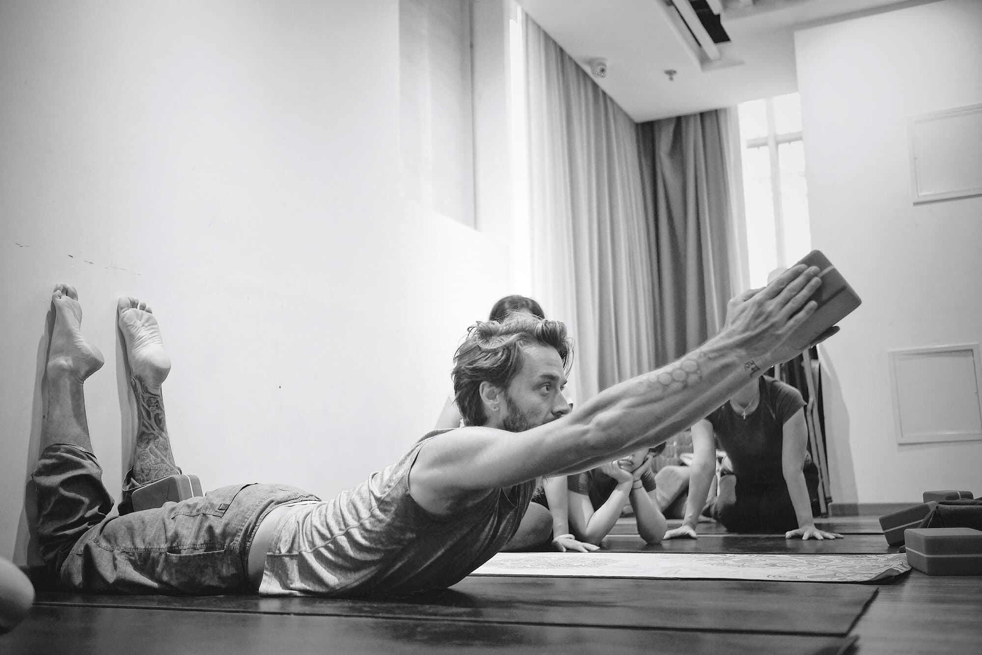 Jason Bowman giving yoga class instruction in San Francisco