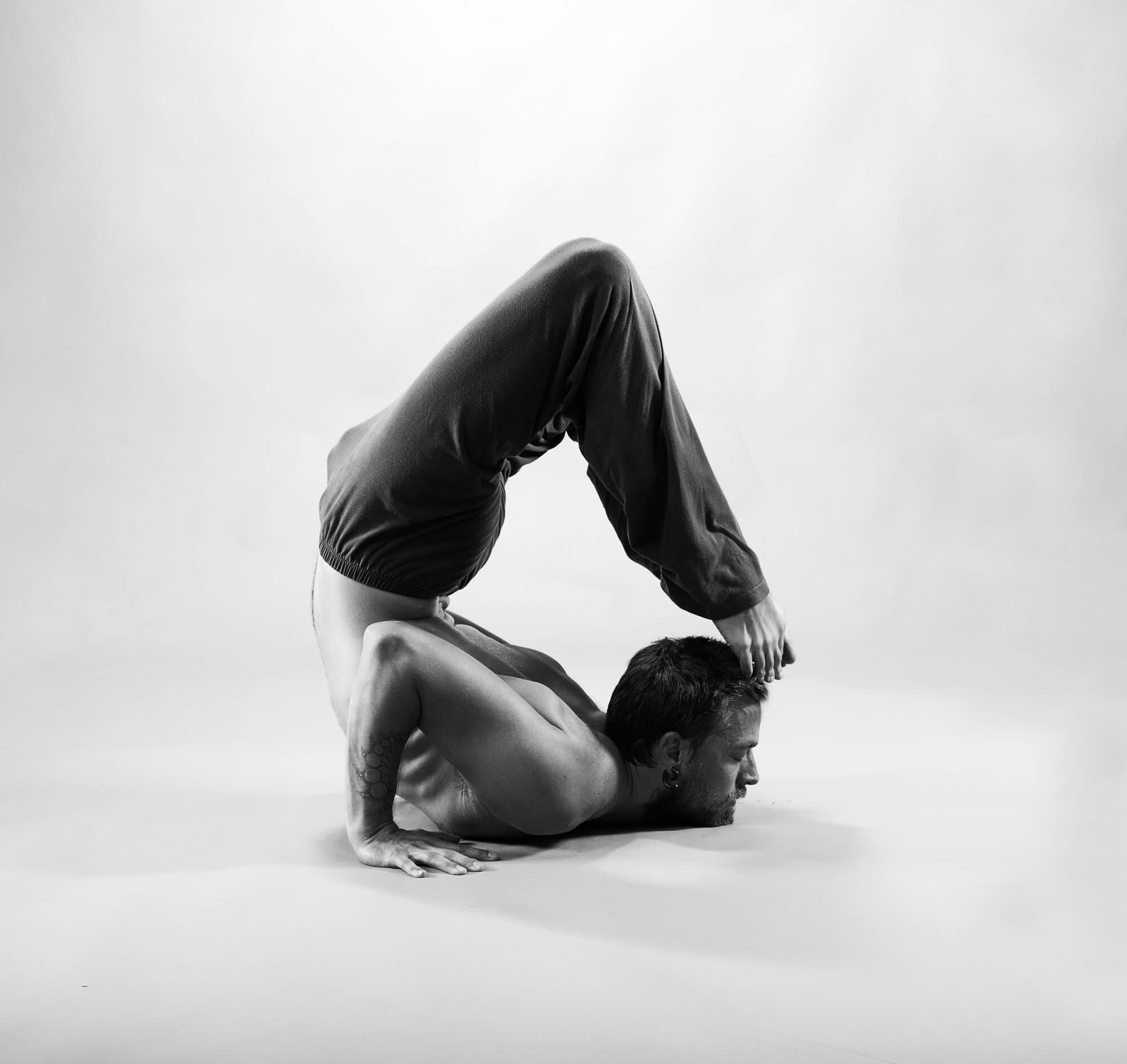 Jason Bowman, yoga teacher, in an advanced backbend pose