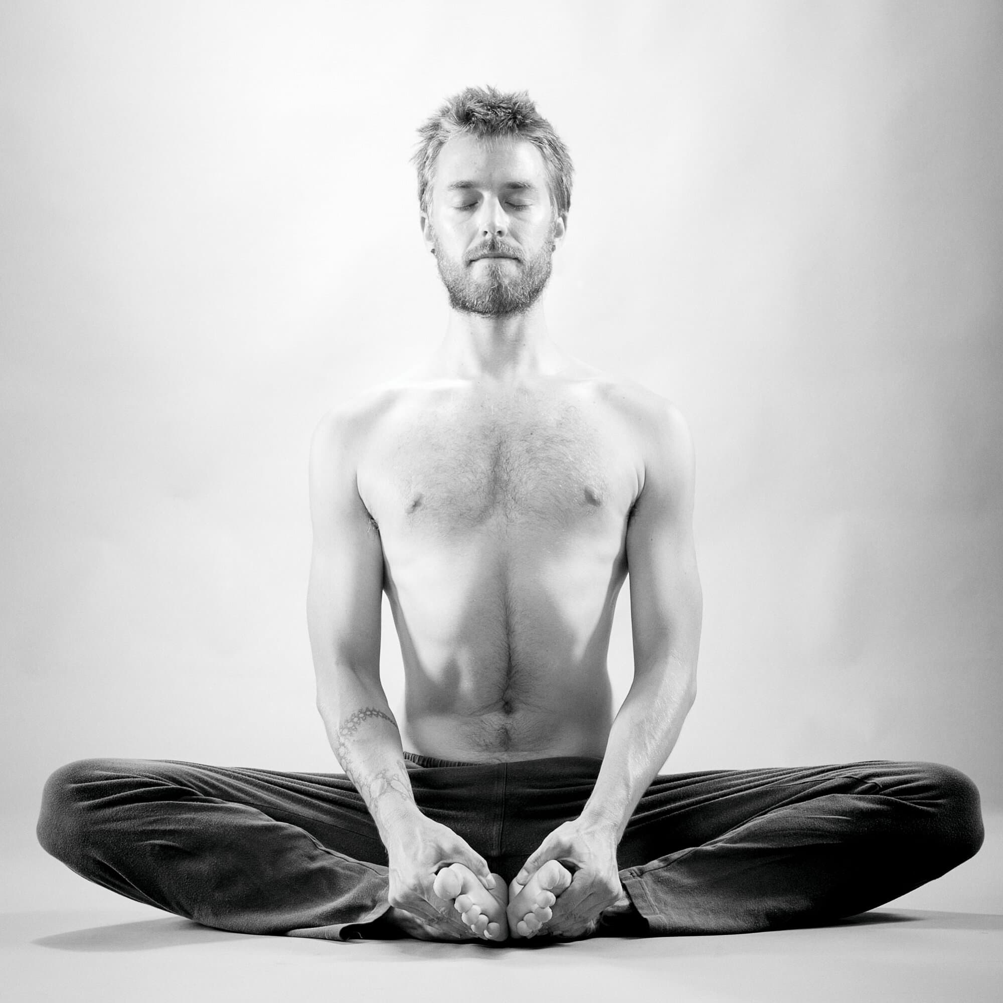 Jason Bowman practicing Baddha Konasana, yoga teacher in San Francisco