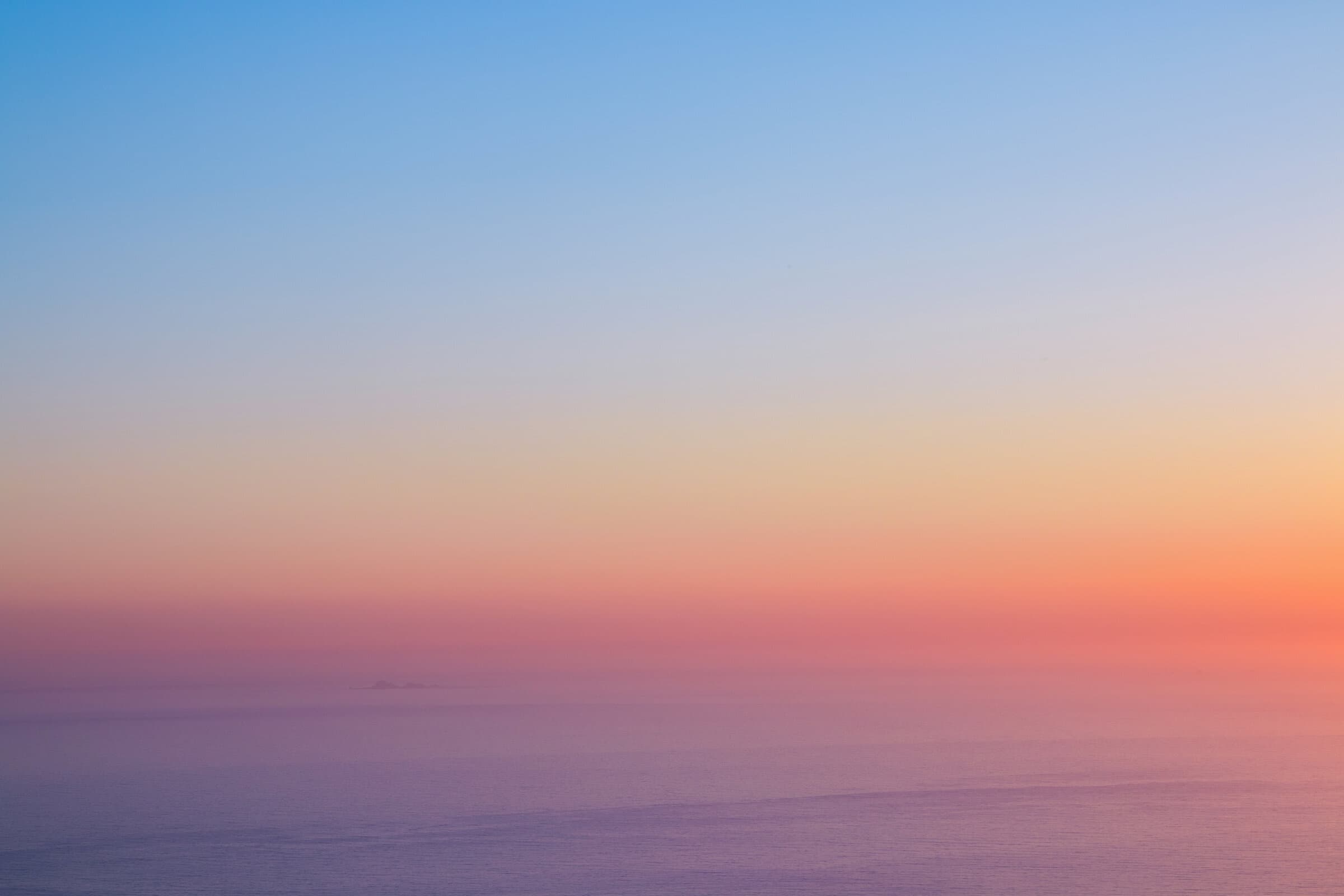 Gradient sunset sky in blue and orange, fine art photograph by Jason Bowman