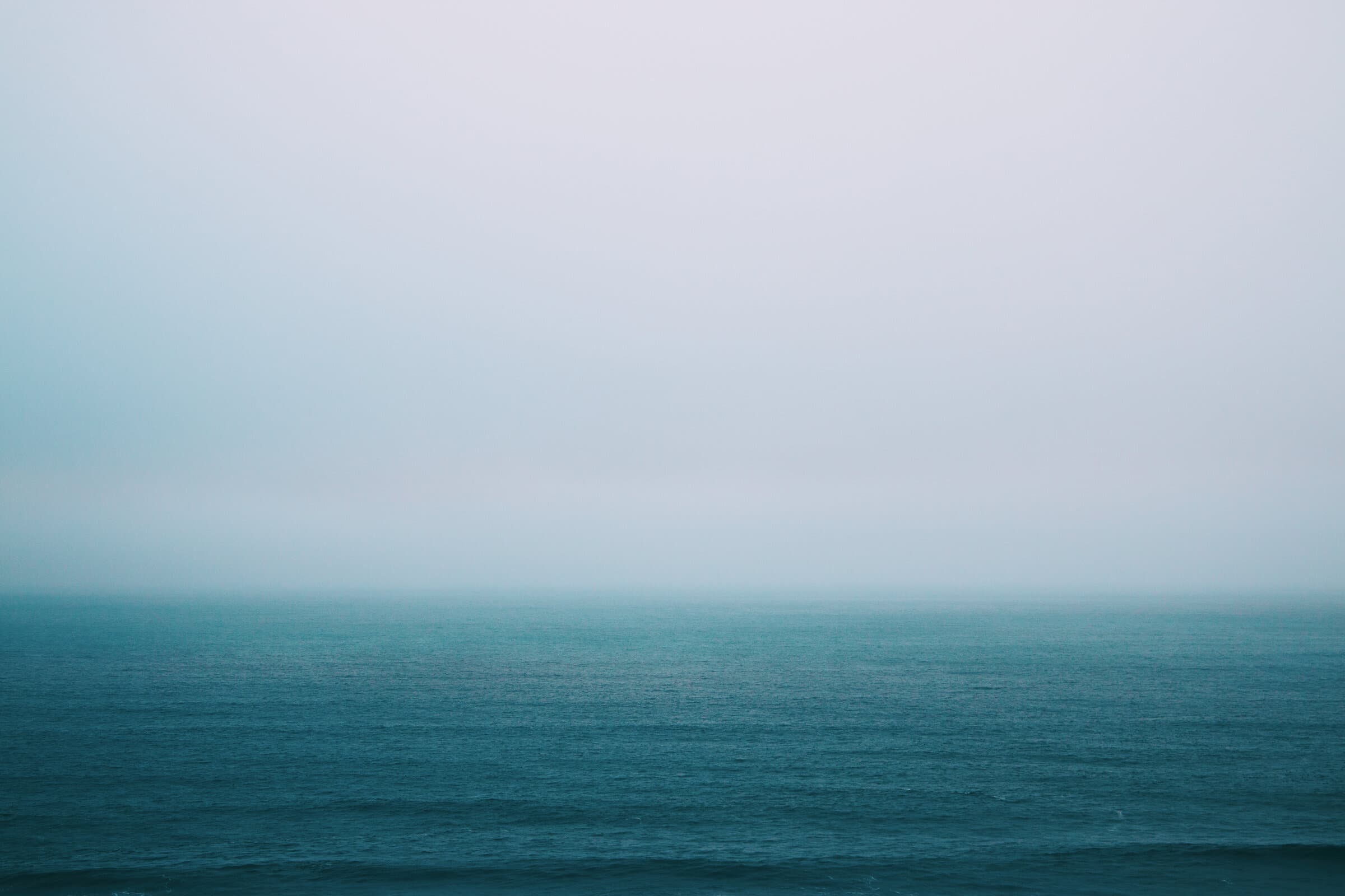 Teal misty ocean horizon, fine art photograph by Jason Bowman
